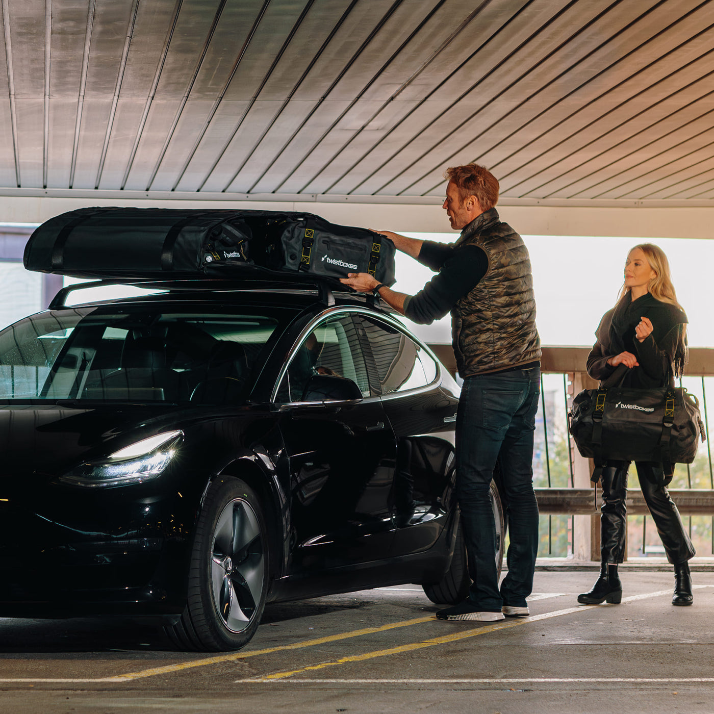 Twistboxes roof box unpacked sideways showing included bags